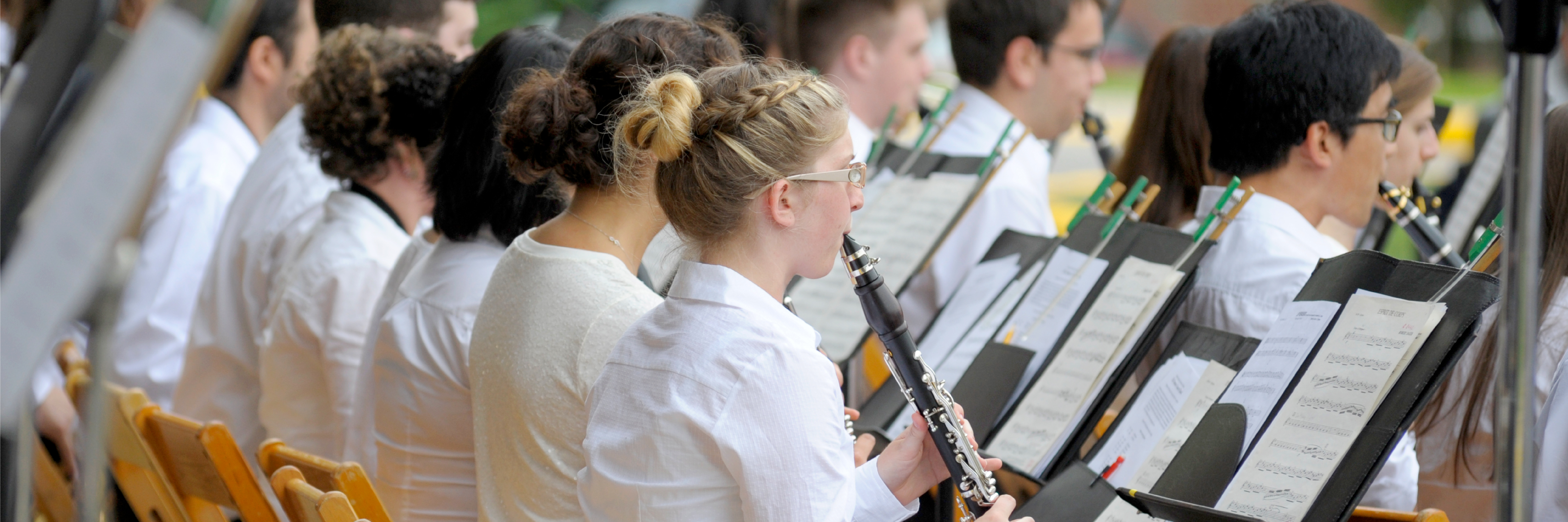 Image of students playing wind instruments in the Summer Band Concert